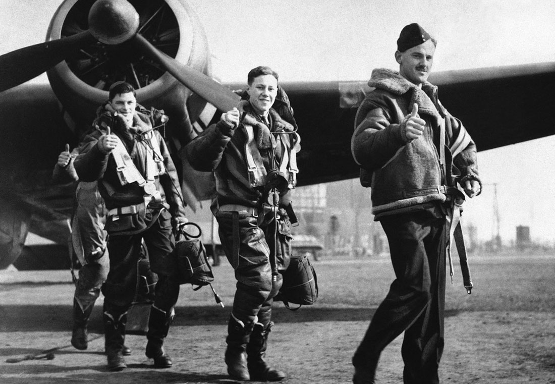 On April 22, 1940, members of a British RAF Handley Page "Hampden" bombing squadron, wearing Irvin flight jackets, give a thumbs-up as they return from attacking German warships off Bergen, Norway.